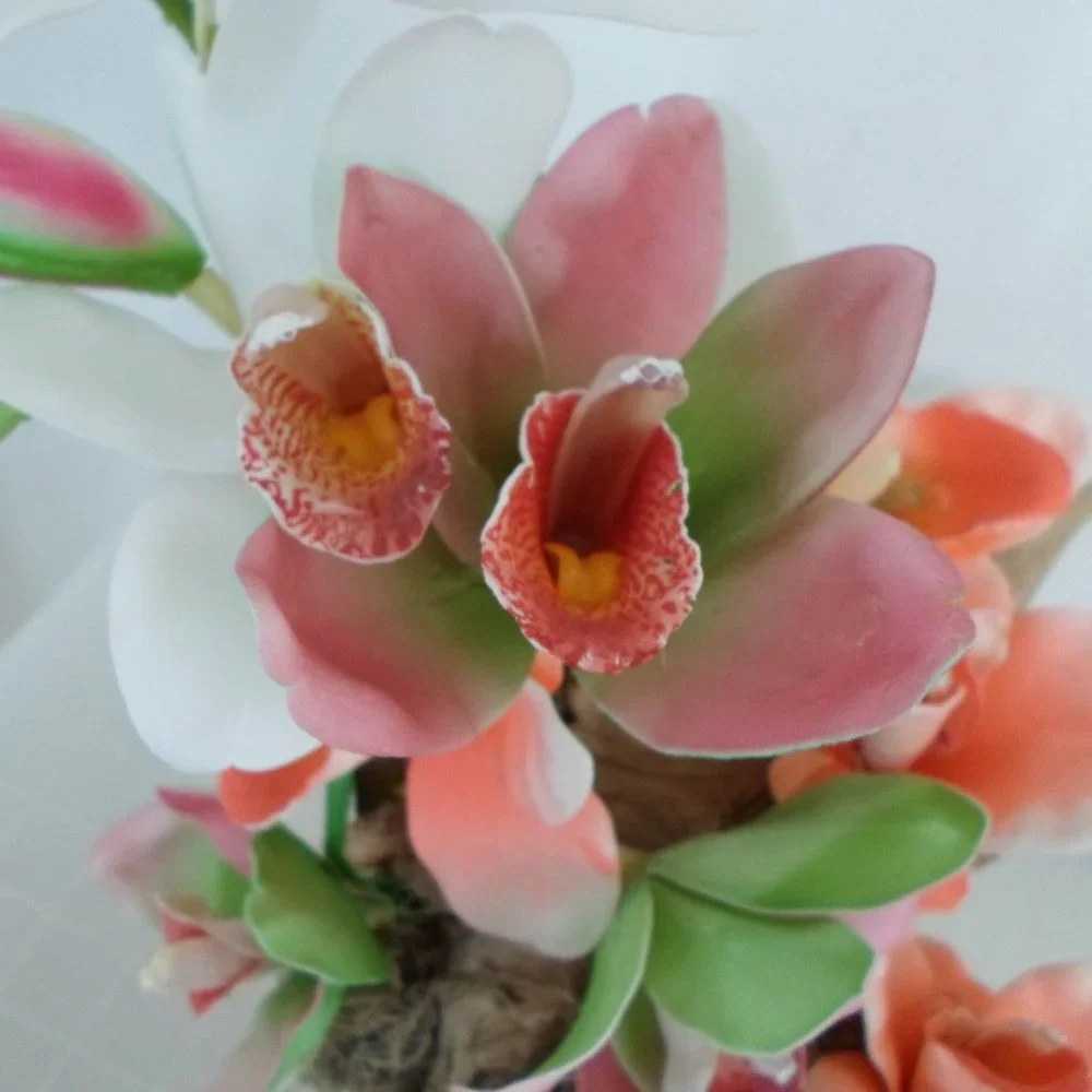 Fabric Orchids on a Tree Trunk Floral Arrangement